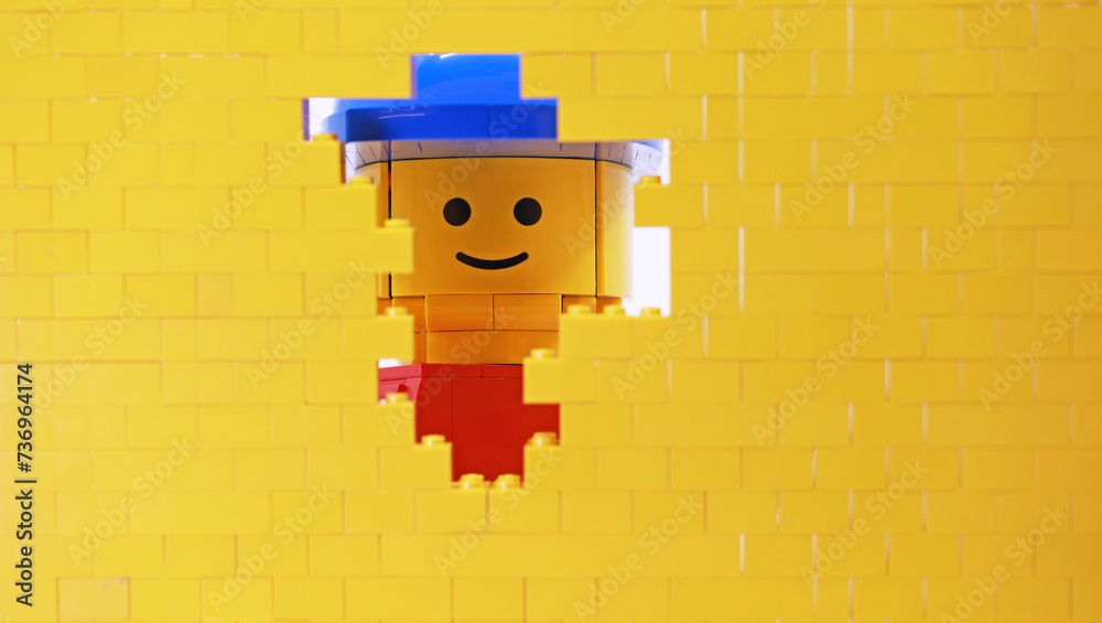 Naklejka premium Hong Kong -February 15 2024: a giant man is watching through the small hole of wall