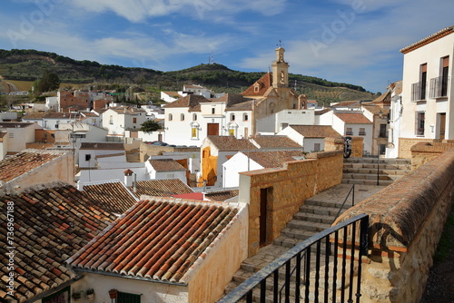Santa Maria de Jesus church, located on Portichuelo square in Antequera, Malaga province, Andalusia, Spain, with whitewashed houses and typical roofs
