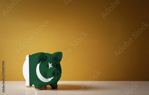 Piggy bank with painting of Pakistan flag. The problem is in the economy. Economic crisis. Saving money concept.