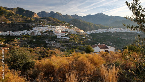 General view of the village Frigiliana, Axarquia, Malaga province, Andalusia, Spain, with surrounding mountains (National Park Sierra de Tejada, Almijara y Alhama)  and with whitewashed houses photo