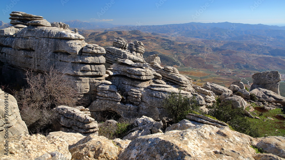 Impressive karstic landscape with unusual limestone rock formations at the Mirador (Viewpoint) Ventanillas in the National Park Torcal de Antequera, Malaga province, Andalusia, Spain
