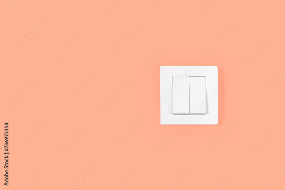 Light switch on orange peach wall. Electricity and light symbol. Light switch on orange peach wall. Electricity and light symbol.