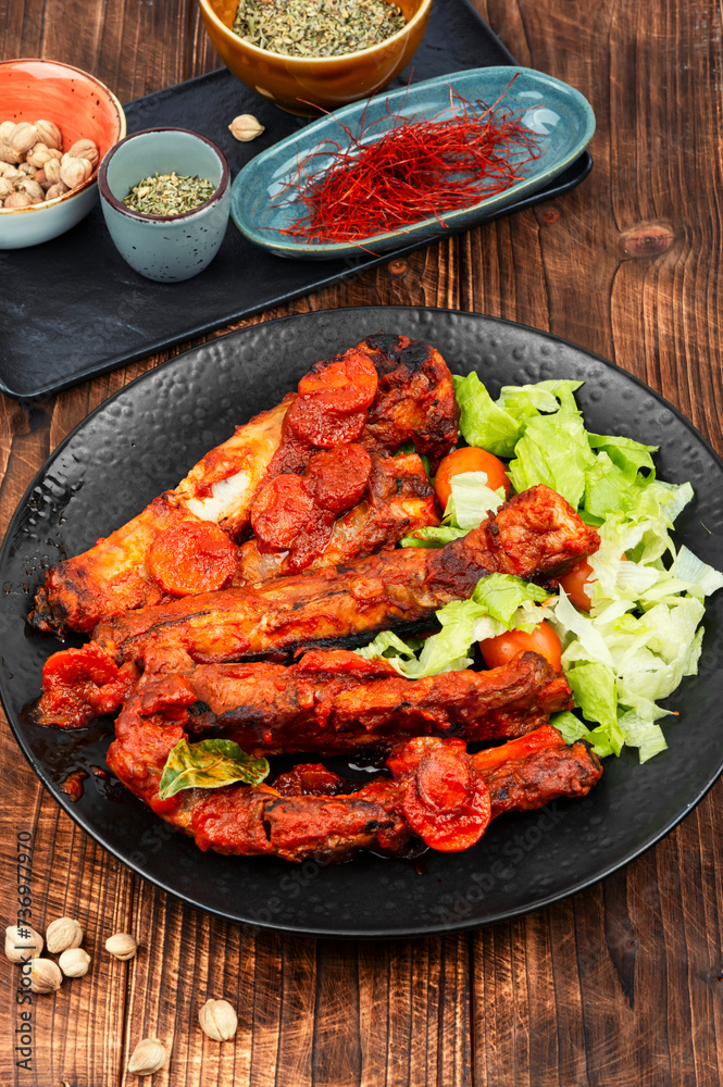 Roasted yummy pork ribs in sauce. Roasted yummy pork ribs in sauce.