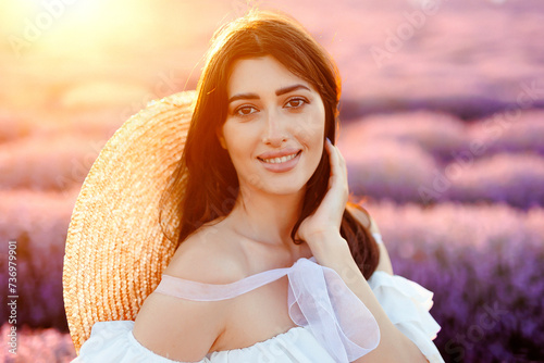 Portrait of a girl in lavender field holding violet lavender flowers photo