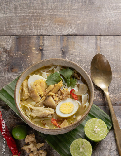 soto ayam, a typical Indonesian food soup isolated on empty space  photo