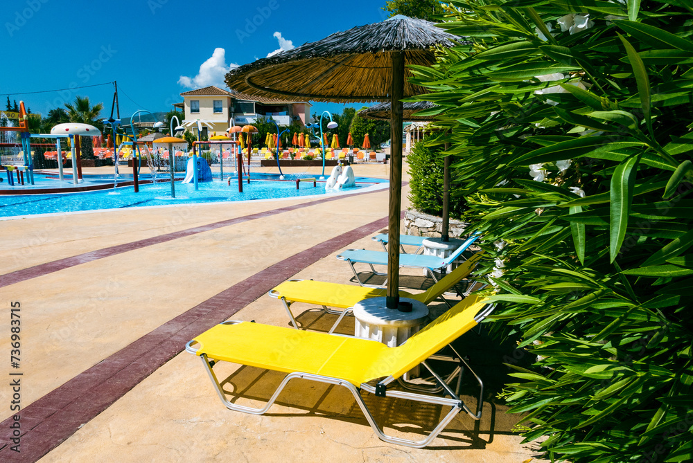 Empty sunbeds in paradise aquapark.