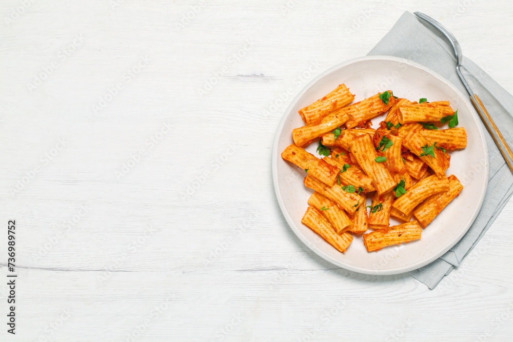 Plate of macaroni with tomato and parsley Plate of macaroni with tomato and parsley