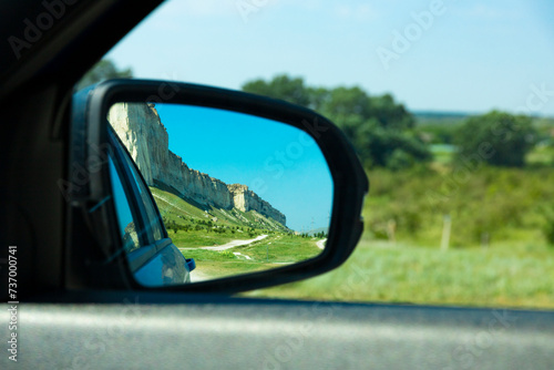 Beautiful mountains, White Rock, wildlife in the rearview mirror of the car.
