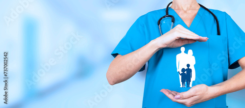 Health, vaccinations, health insurance, life insurance for the whole family. Practicing doctor with hand protective gesture and family symbol. Copy space.