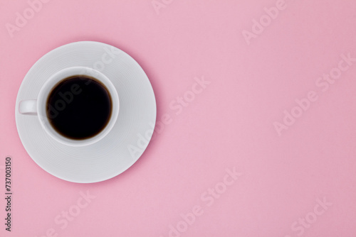 Top view image of coffee cup on pink paper background. Copy space for input the text. Flat lay. 