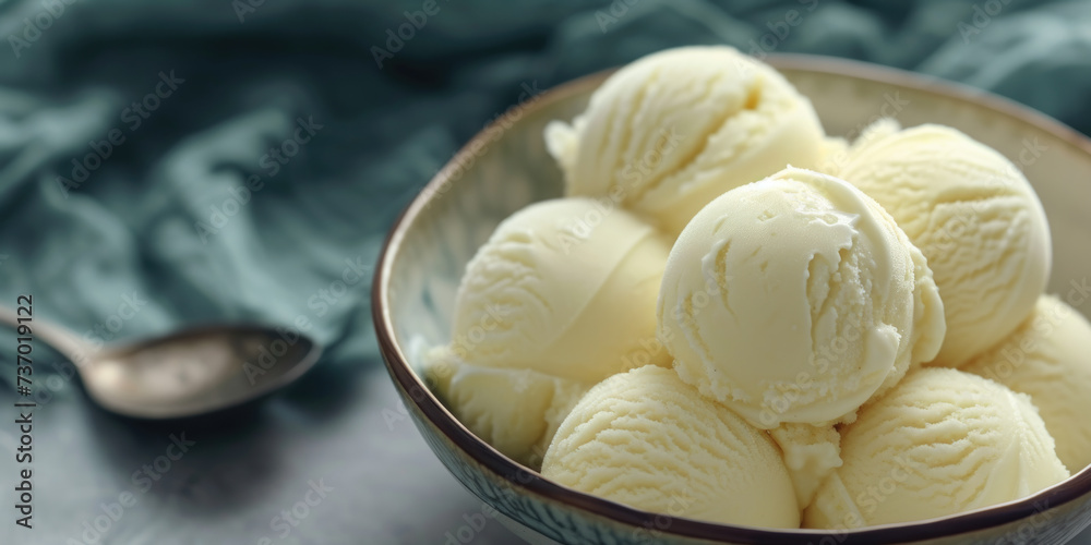 Delicious bowl of ice cream sitting on top of table. Perfect for food-related projects and advertisements Delicious bowl of ice cream sitting on top of table. Perfect for food-related projects and advertisements