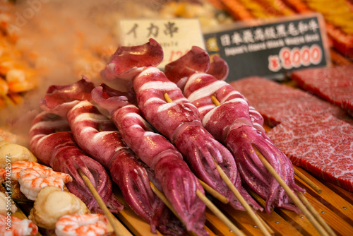 Photos Squid at a food stall at the Tsukiji Outer Market in the city of Tokyo in Japan