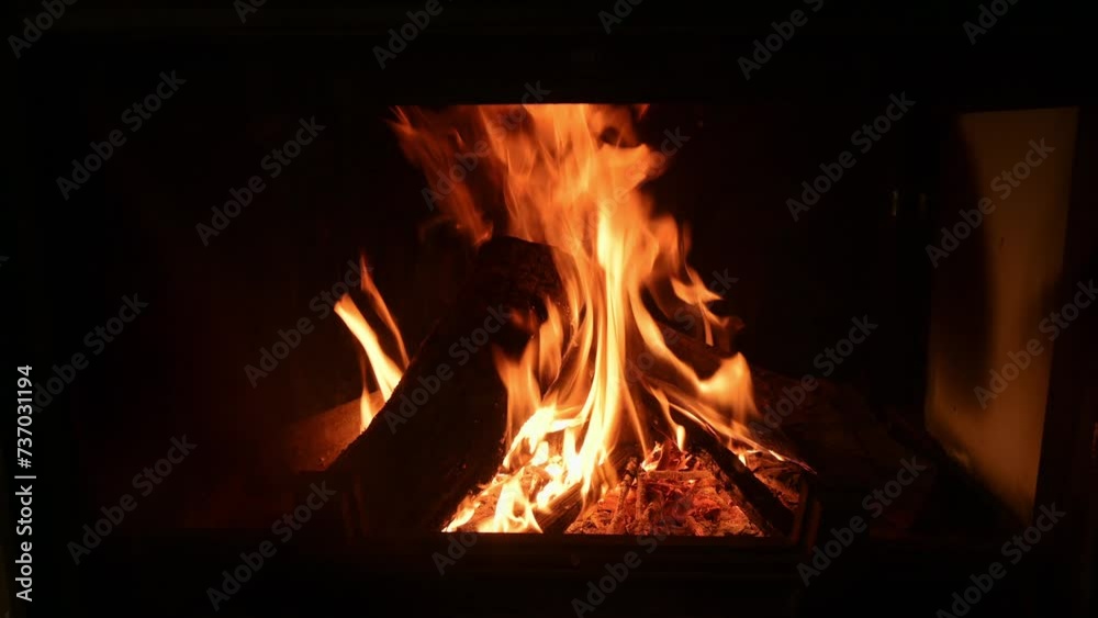 Close-up view of burning fireplace with wooden logs. Close-up view of burning fireplace with wooden logs.