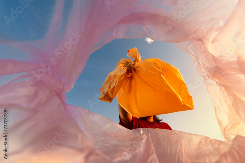Volunteer women Collect plastic bags at public parks for zero-waste, garbage and pollution, global warming, and climate change.
