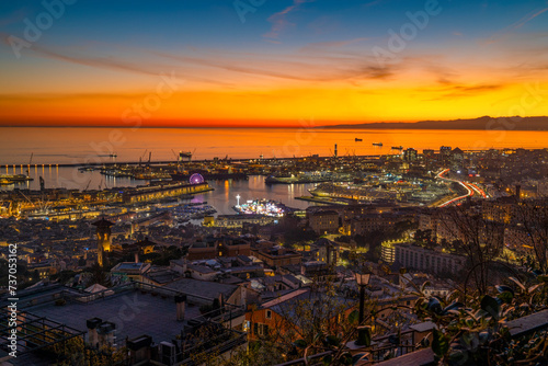 GENOA, ITALY, DECEMBER 18, 2023 - Aerial view of the port of Genoa at sunset, Italy