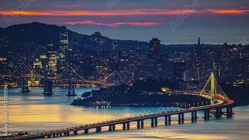 San Francisco city skyline and Bay Bridge - colorful sunset to nighttime time lapse photo