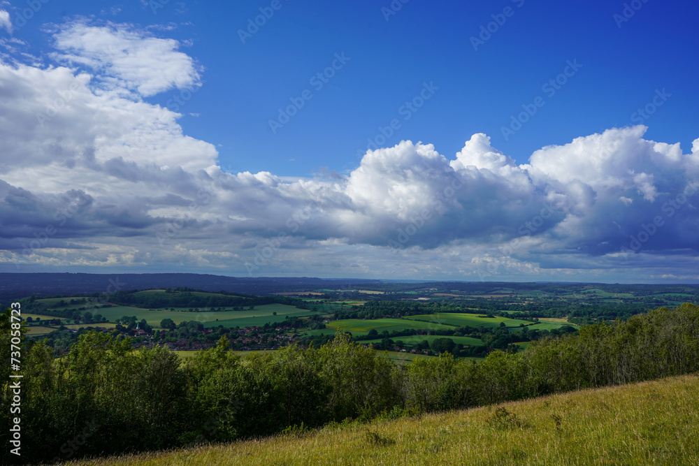 View of farm fields and clouds in the countryside   