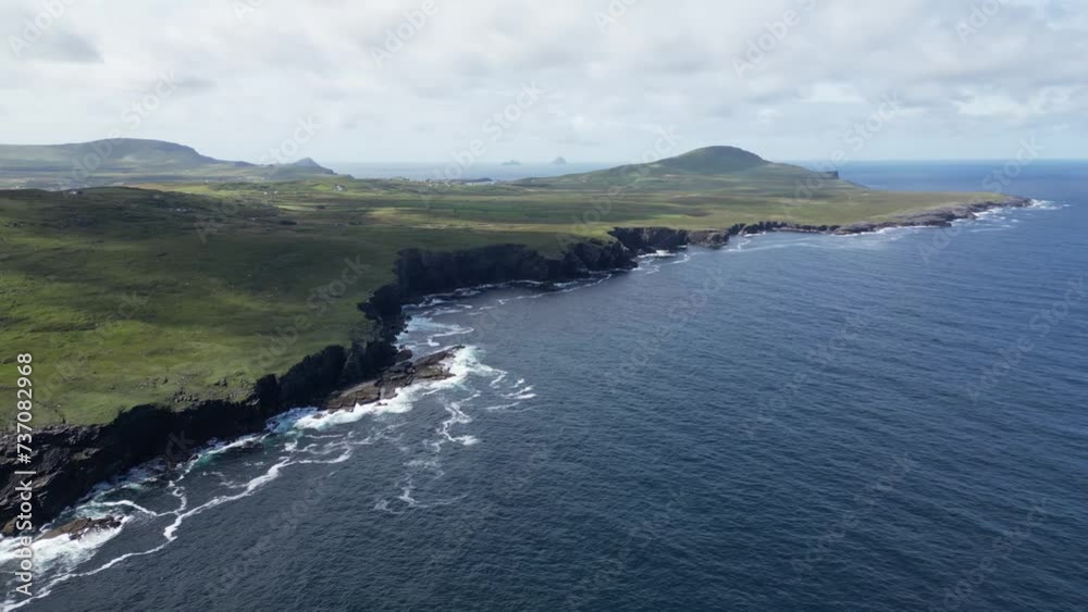 Valentia island, ireland, with rugged coastline and rolling green hills, aerial view Valentia island, ireland, with rugged coastline and rolling green hills, aerial view