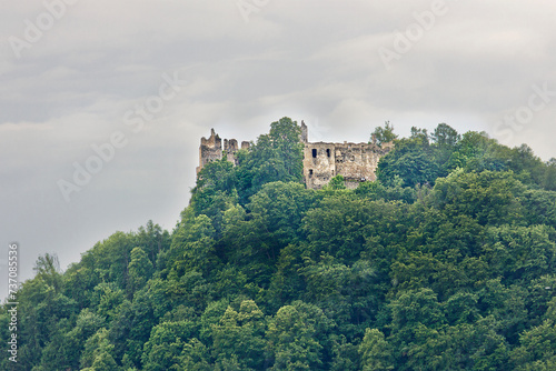 Povaz (Bystrice) Castle in Slovakia. Ruins of an ancient castle on top of a mountain among trees photo