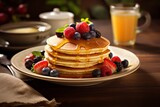 A breakfast setting with a stack of pancakes in a vintage cafe, drizzled with syrup and topped with fresh berries