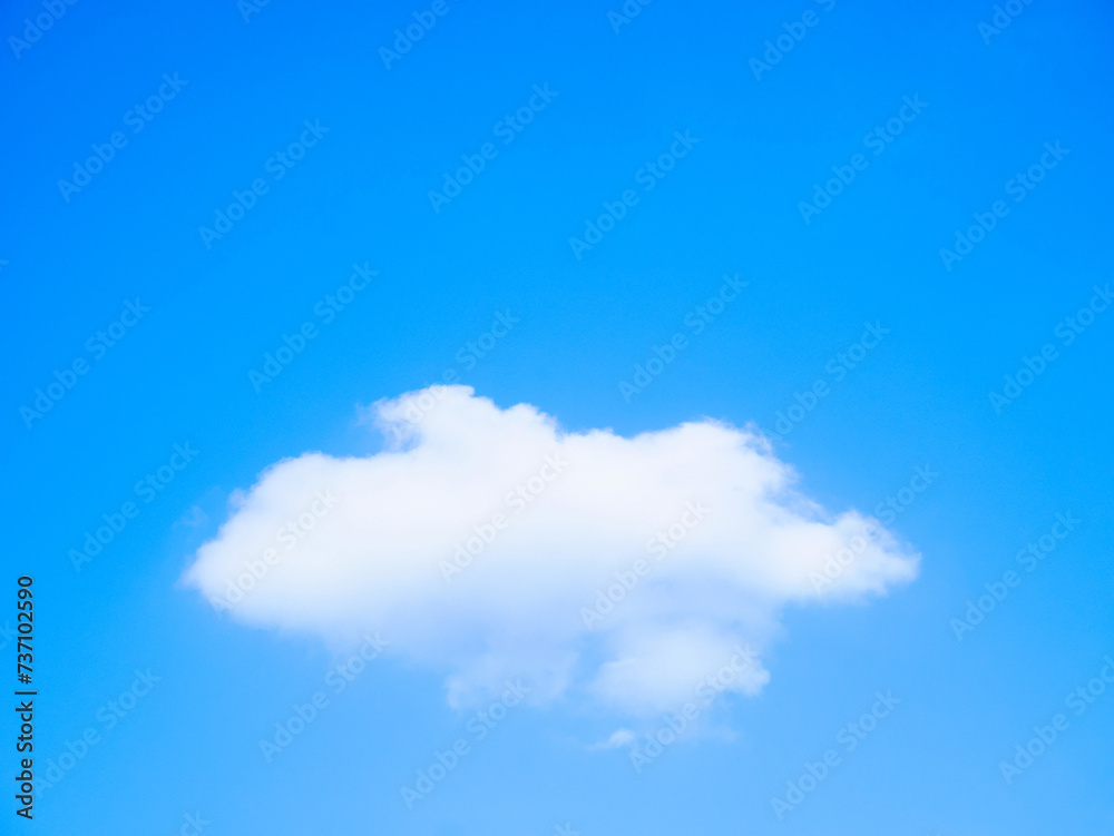 Fluffy cloud on clear blue sky