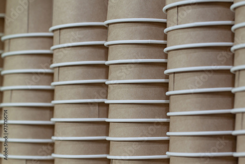stacks of paper glasses prepared for use in a cafe