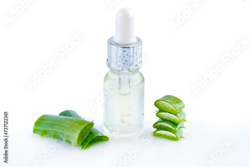 Cosmetic serum, gel with aloe vera extract in glass container with pipette on white background. Natural cosmetics concept. For Health and beauty products.
