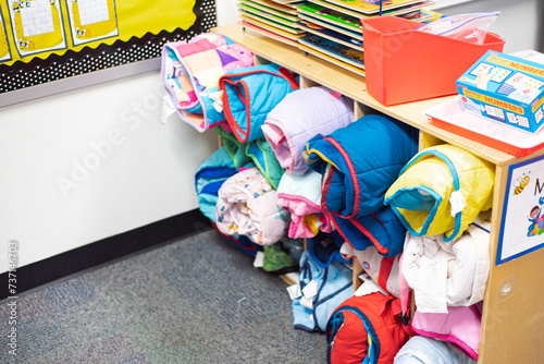 Obraz na płótnie Top view school storage cabinet full of rolled toddler nap mats at preschool kin