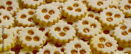 Christmas biscuits baking, rogues, shortcrust pastry biscuits sprinkled with jam and icing sugar, Christmas background