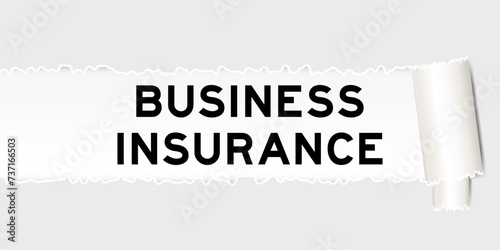 Ripped gray paper background that have word business insurance under torn part