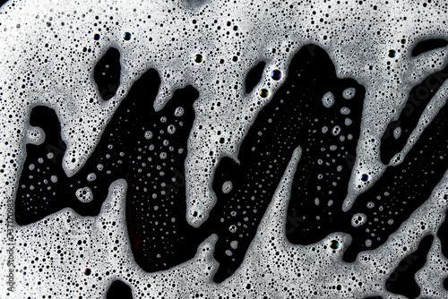 Abstract background white soapy foam texture. Shampoo foam with bubbles