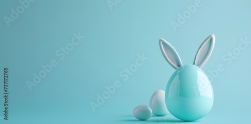 Blue easter egg with bunny's ears isolated on blue background with copy space