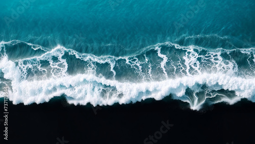 A black background with a blue ocean and white waves