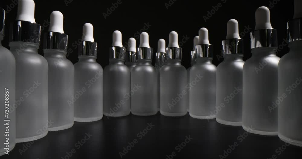 Transparent frosted bottles for cosmetics in production. Shelf life and storage features of essential oils Transparent frosted bottles for cosmetics in production. Shelf life and storage features of essential oils