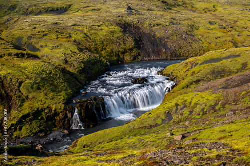 Long exposure view of famous waterfalls of river Skógá. Skógafoss. Magnificent Iceland in august. Fimmvörðuháls Hiking Trail. Popular Travel destinations. Fosstorfufoss waterfall photo