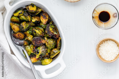 Roasted brussel sprouts topped with balsamic vinegar and parmesan cheese.