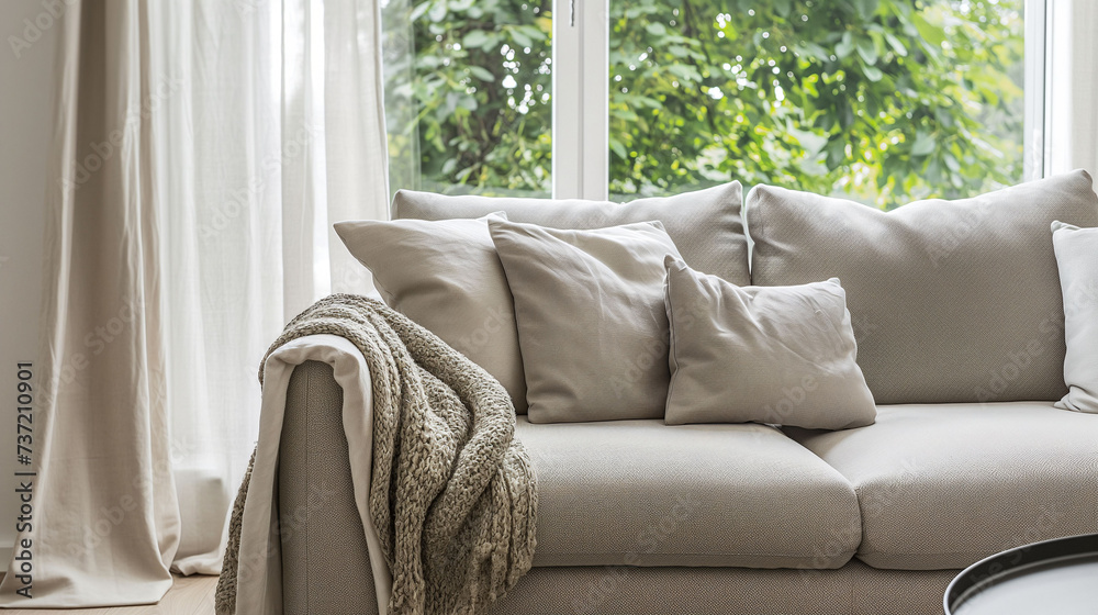 Linen white sofa is sitting in front of windows, in the style of soft-focused realism, dark beige and gray