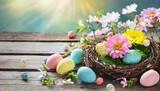 Colorful spring flowers with Easter eggs in birds nest on rustic wooden board with copy space for your text. Celebration concept, greeting card