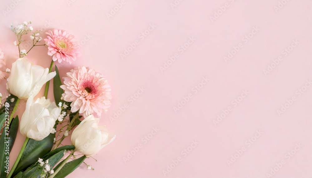 Beautiful spring flowers on light pink background. Top view