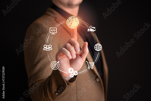 Personal data protection concept.Businessman using fingerprint indentification to access personal financial data. Idea for E-kyc,biometrics security, innovation technology against digital cyber crime. photo