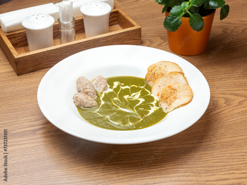 Broccoli soup with croutons in a bowl. Lunch. Broccoli soup with croutons in a bowl. Lunch.