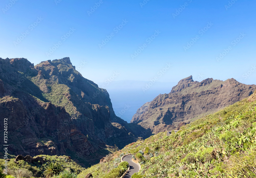 Beautiful scenery around the road to Masca village on Tenerife. Green tropic mountains with palms.