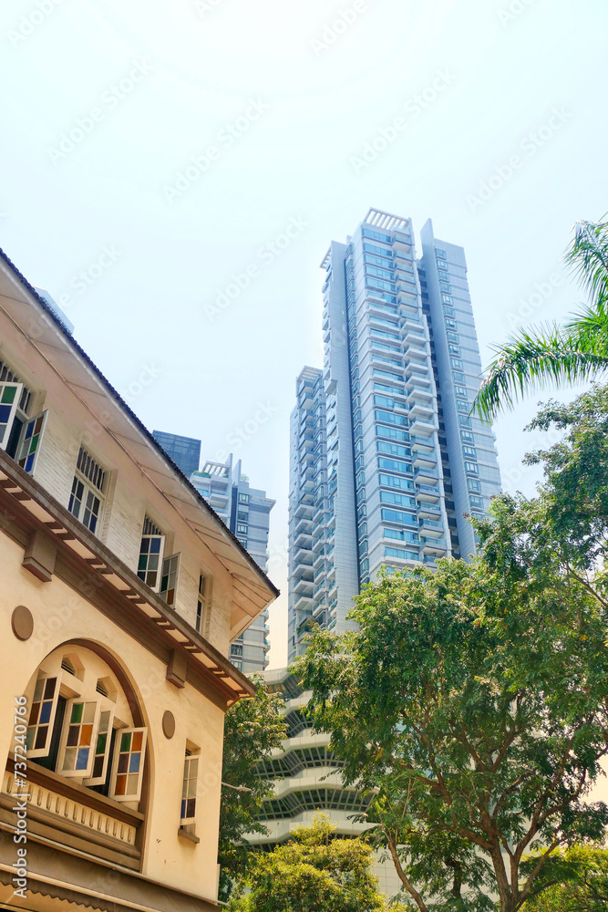 Traditional Straits Chinese Shophouses against skyscrapers in Singapore