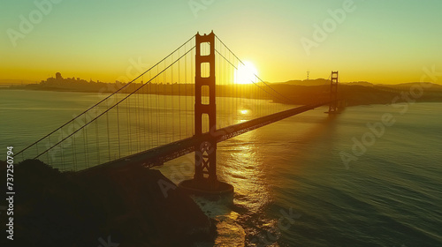 Sunrise glow at the Golden Gate Bridge: A serene San Francisco dawn casting radiant light over the iconic suspension bridge and reflecting on the calm bay waters.