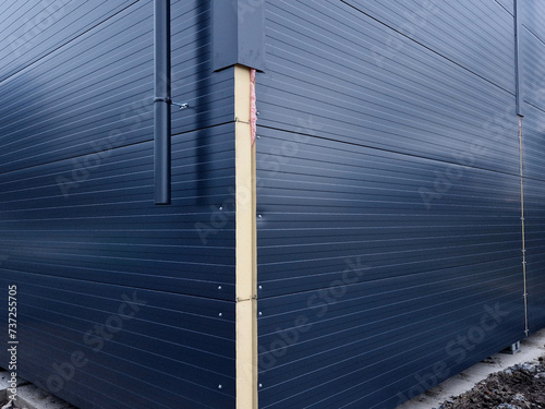 sandwich polyurethane vapor barrier building panels. the structure is made of steel from assembled beams and a shell with a metal surface. hall. stables, warehouses, haylofts photo