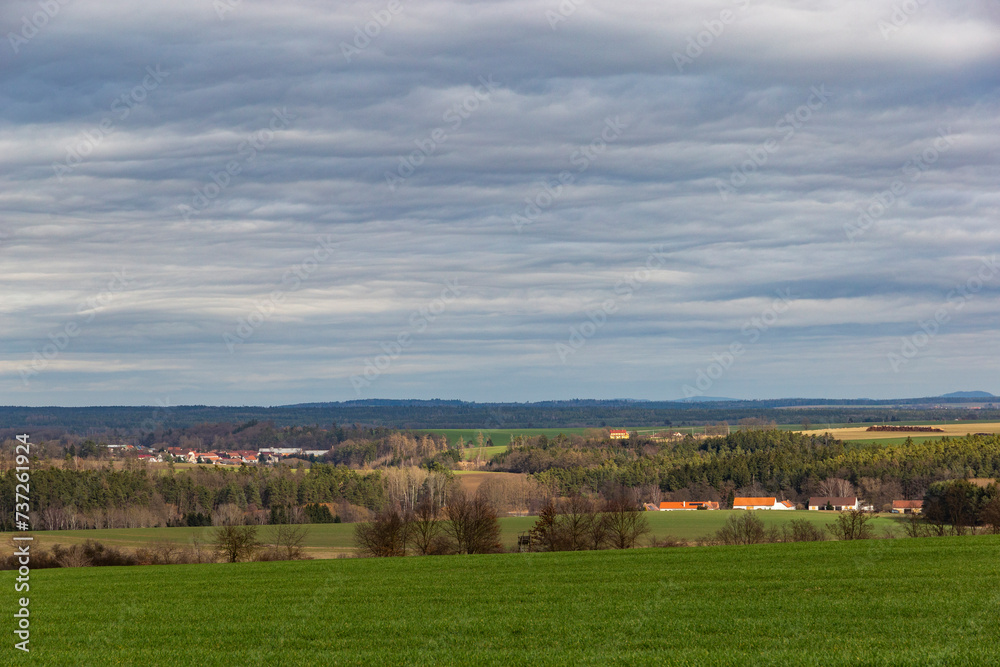 Early springtime in European countryside. Villages on the horizon.