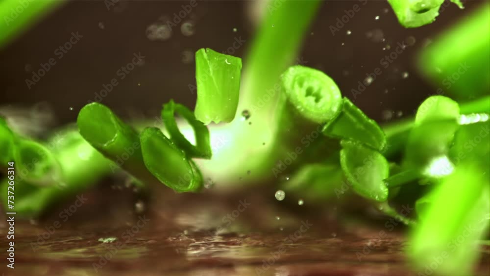 A cook chops green onions. Filmed on a high-speed camera at 1000 fps. High quality FullHD footage A cook chops green onions. Filmed on a high-speed camera at 1000 fps. High quality FullHD footage