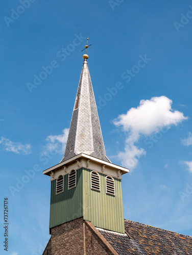 Wooden tower with constricted spire of Haghakerk, church in center of Heeg, Friesland, Netherlands photo