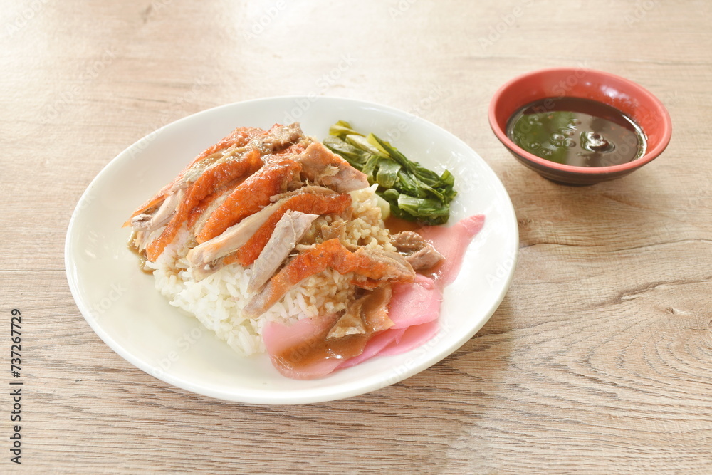 slice roasted duck topping rice with pink pickled ginger and boiled cabbage dressing sweet soy sauce on plate slice roasted duck topping rice with pink pickled ginger and boiled cabbage dressing sweet soy sauce on plate