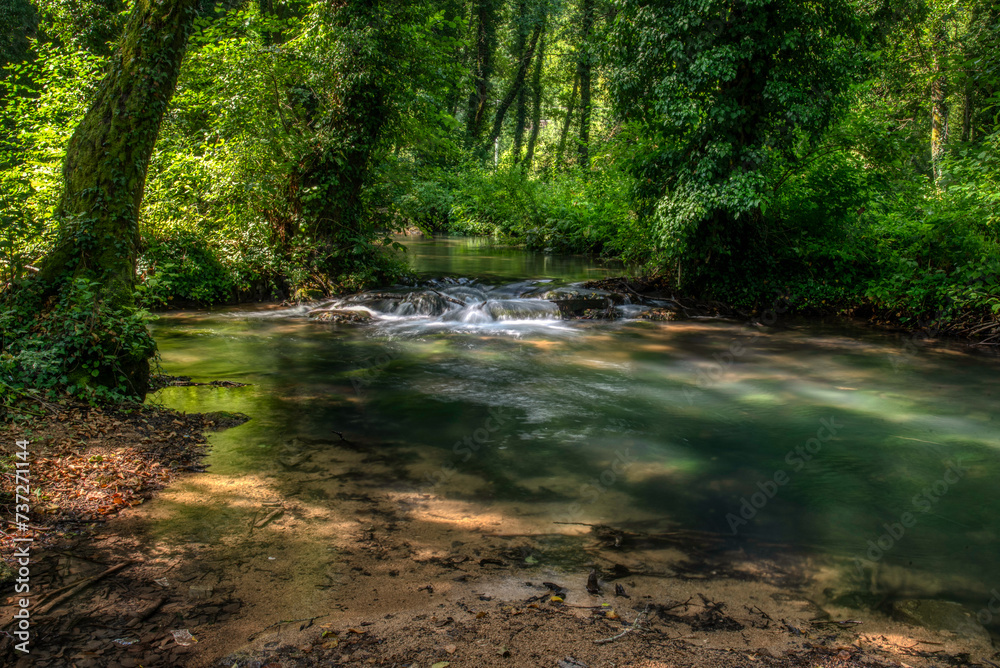 Turquoise color of water in the summer on the river Janj Turquoise color of water in the summer on the river Janj